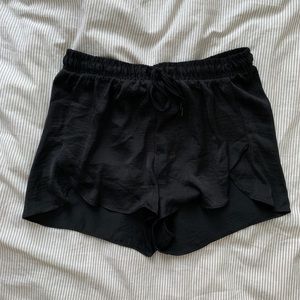 Black satin-y dolphin shorts